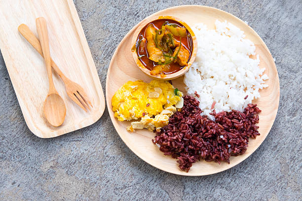 istock rice and red curry with pork and omelet. (Thai panang curry) 615726446