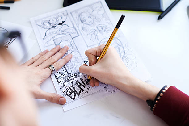 Male hands drawing the comics Male hands drawing the comics comic book layout stock pictures, royalty-free photos & images