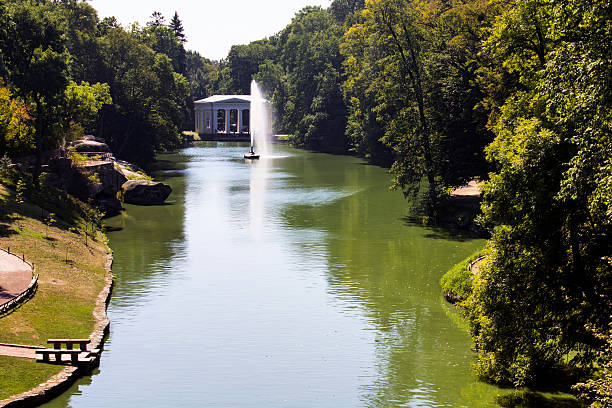 istock Fountain on a pond on a bright sunny day sofiyevsky park. 615727518