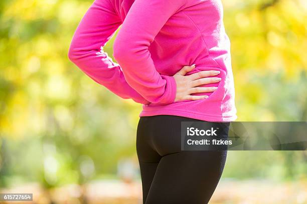 Warming Up Outdoors In The Autumn Hands On The Hips Stock Photo - Download Image Now