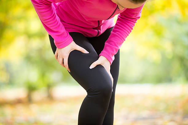 istock Hands grabbing a hip, sport injury 615727856