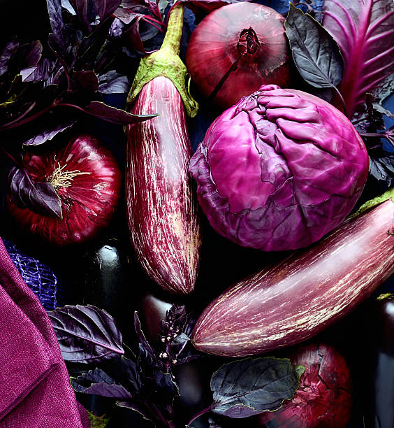 istock Collection of fresh purple vegetables,eggplant, onions, cabbage and basil 615729034