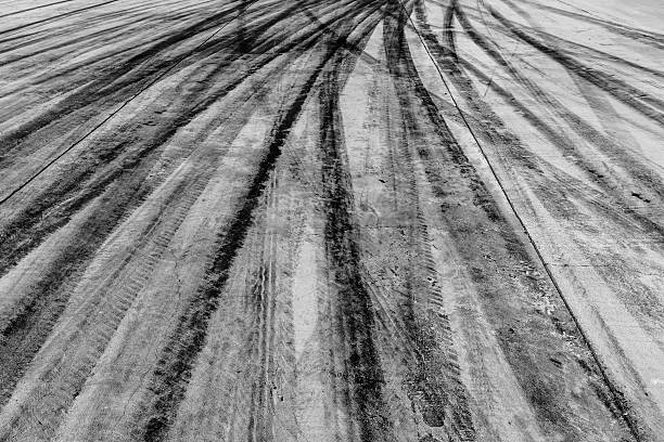 istock black tire tracks skid on road 615729106