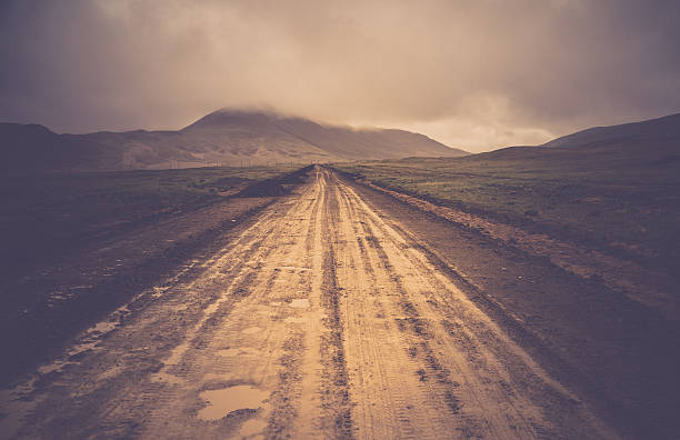 istock Muddy mountain road  in TIbet 615732336