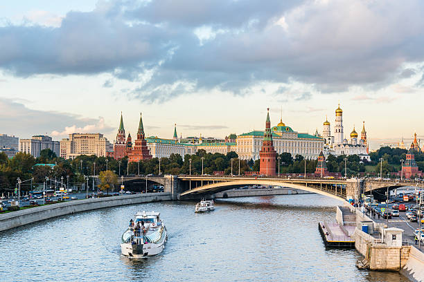 istock Cruise ship in front of Kremlin on the Moscow River. 615732550