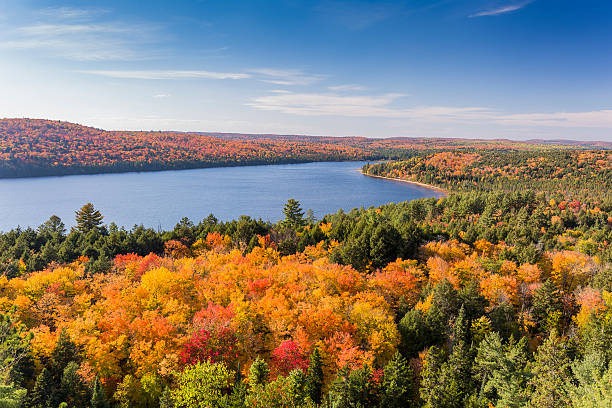 Overlooking a lake surrounded by brilliant fall foliage - Algonquin Provincial Park, Ontario, Canada