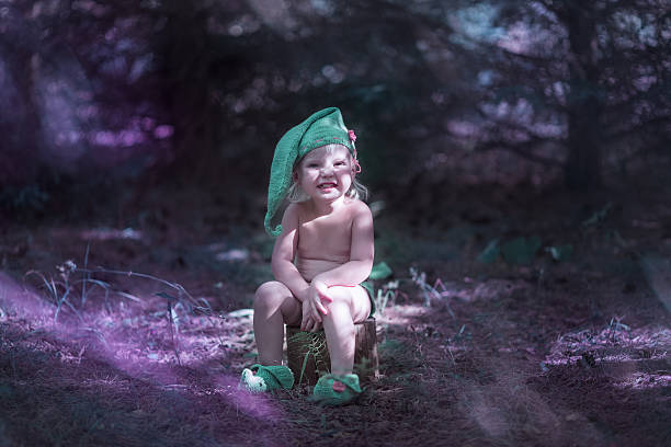 istock Little girl in elf costume 615734252