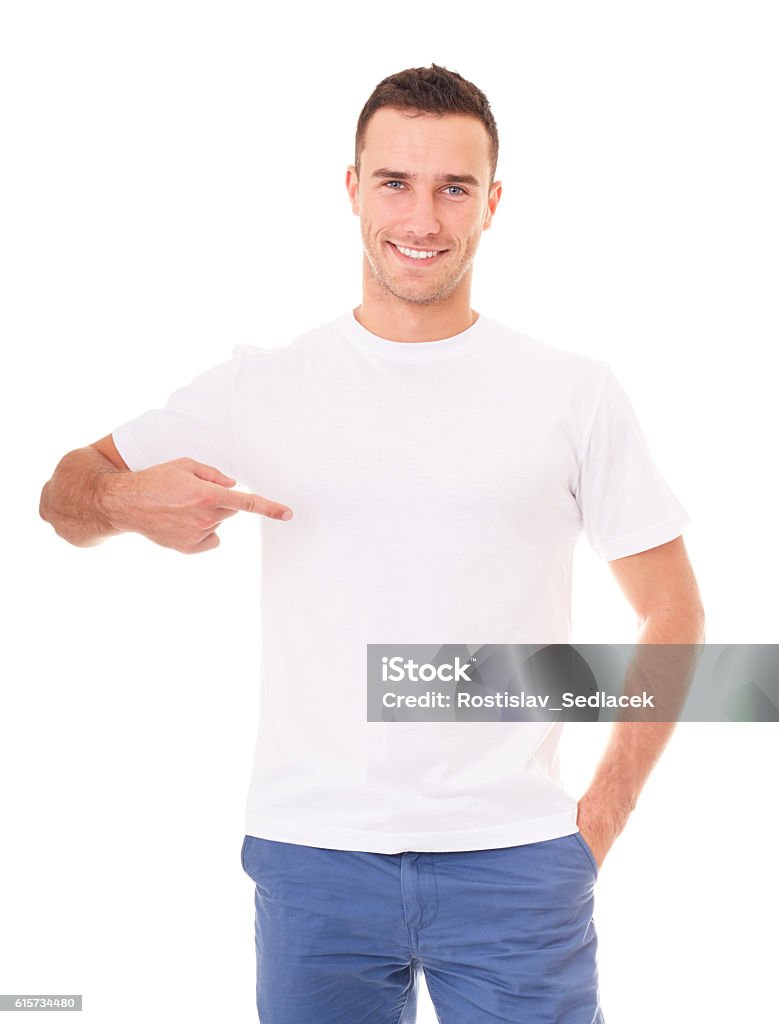 Smiling man showing empty copyspace Smiling man showing empty copyspace on white t-shirt T-Shirt Stock Photo