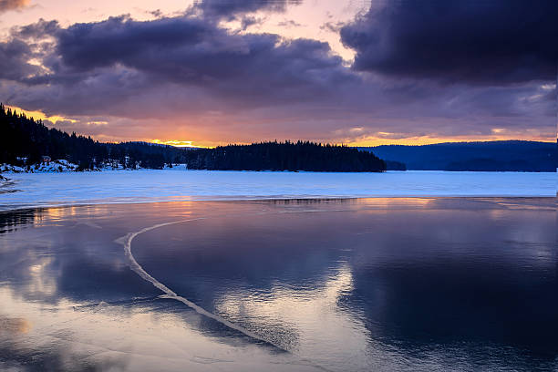 istock Cold lake in the winter during sunset 615734738
