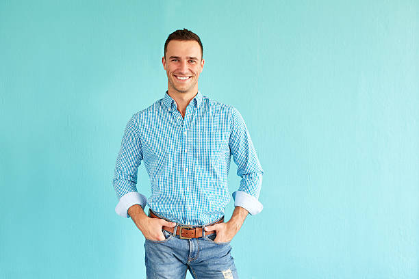 istock Happy man with hands in pockets 615734858