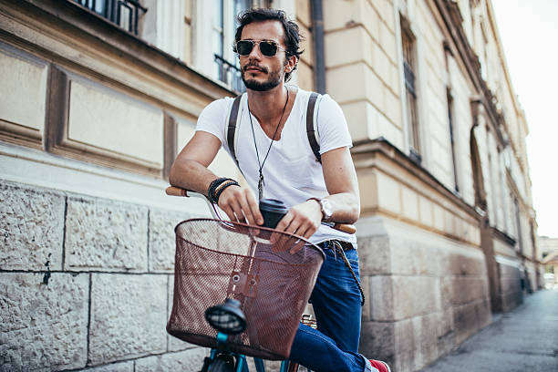 istock Handsome man sitting on bike 615735174
