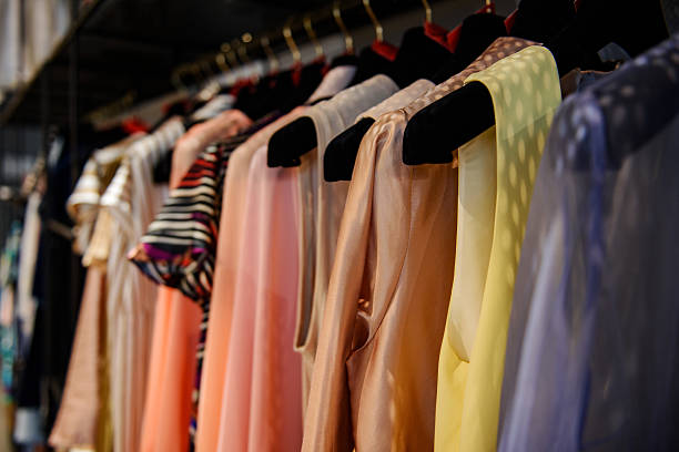 istock Clothes on racks in a fashion boutique 615736430