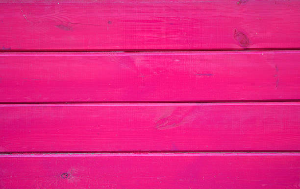 istock Wooden planks painted with pink paint textured  background. 615737044