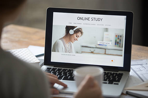 istock Open laptop on the desk, with online study on screen 615737466