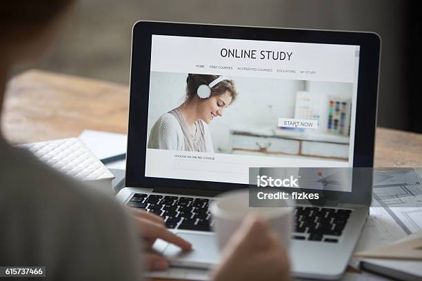 Open Laptop On The Desk With Online Study On Screen Stock Photo - Download Image Now