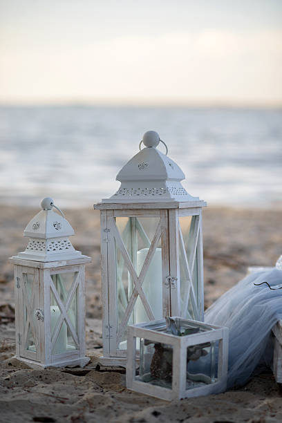istock lamp on the sand. lamp beside the sea 615737598