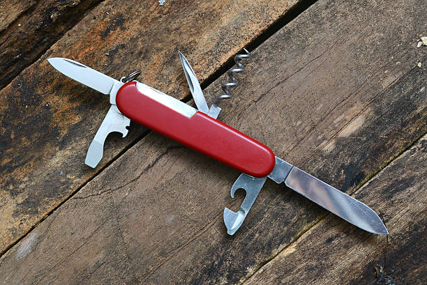 faca multiuso isolada em fundo de madeira - handle multifunction work tool screwdriver - fotografias e filmes do acervo