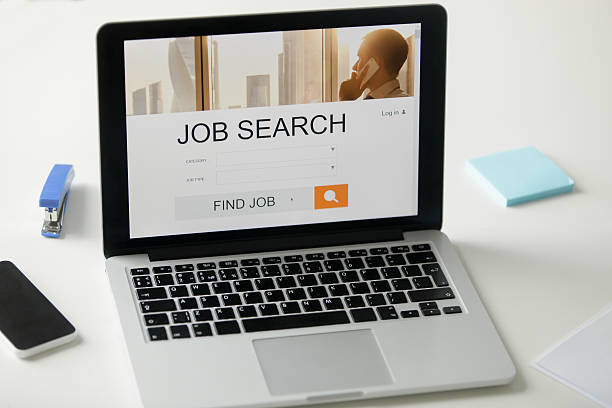 istock Open laptop on the desk, job search title on screen 615738558