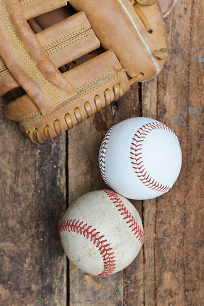 istock Baseball game. Baseball ball on wooden background. 615738760