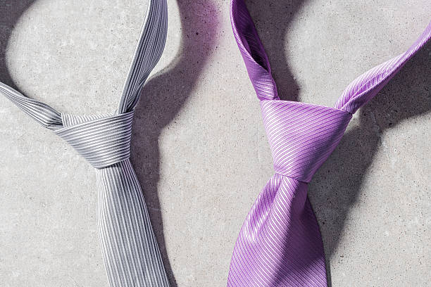 istock Elegant necktie on gray stone background 615738968