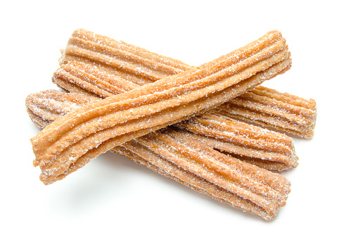 Churros stacked and isolated on white background