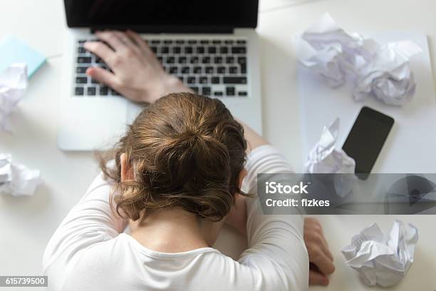 Top View Portrait Woman Lying At Desk Near The Laptop Stock Photo - Download Image Now