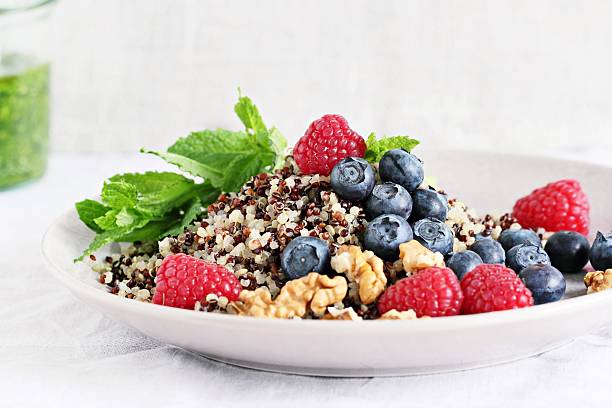Quinoa salad with fresh berries,walnuts and mint