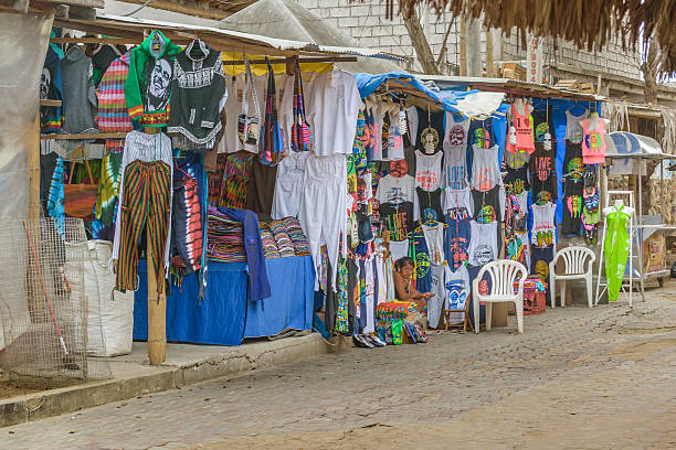 Street of Montanita Ecuador Montanita, Ecuador - October 23, 2015: Picturesque urban scene at street with lots of stores in Montanita, the most famous watering place in Ecuador montanita ecuador stock pictures, royalty-free photos & images
