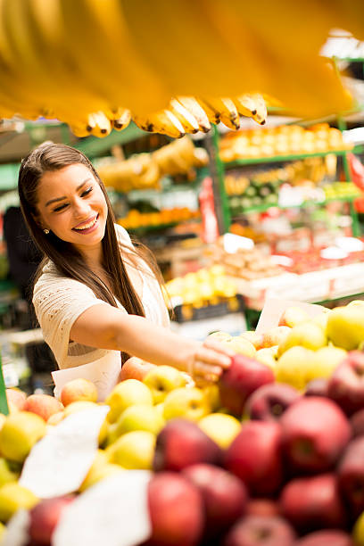 istock Young woman on the market 615744276