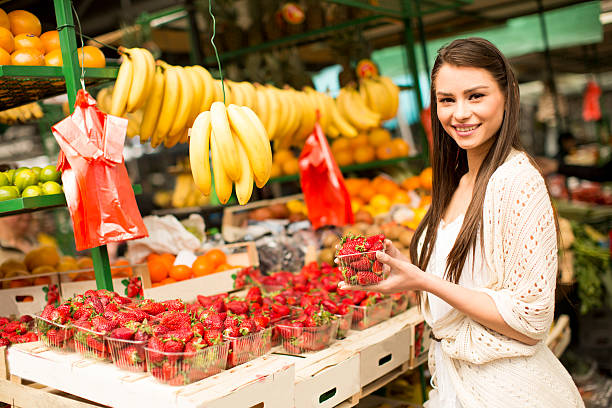 istock Young woman on the market 615744284