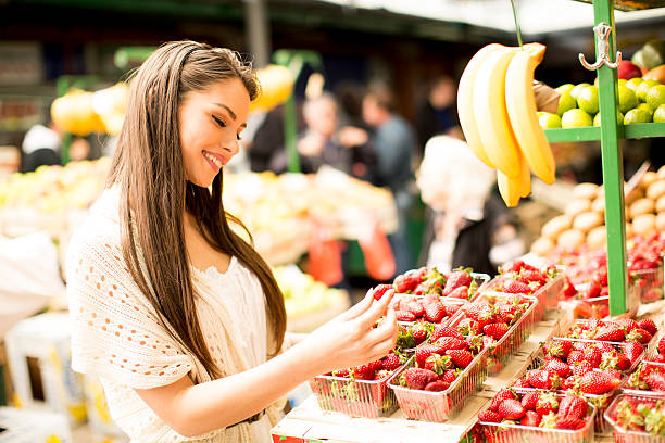 istock Young woman on the market 615744356