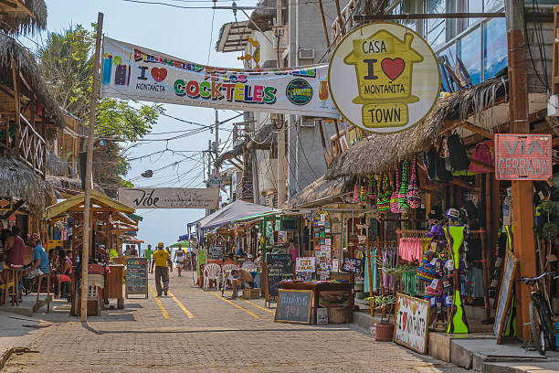 Street of Montanita Ecuador Montanita, Ecuador - October 23, 2015: Picturesque urban scene at street with lots of stores in Montanita, the most famous watering place in Ecuador montanita ecuador stock pictures, royalty-free photos & images