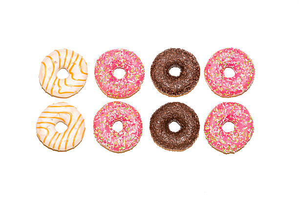istock Colorful glazed donuts isolated on white background, top view 615744970