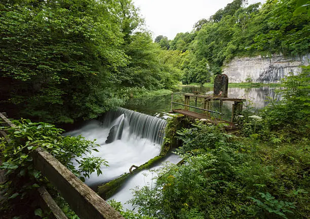 A long exposure at Cressbrook Weir and a millpond, in the Peak District, Derbyshire