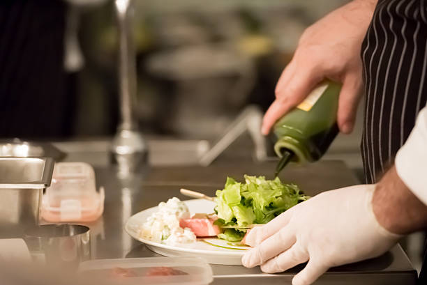 istock Chef pouring sauce in the dish 615748394