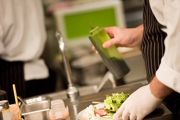istock Chef pouring sauce in the dish 615748538