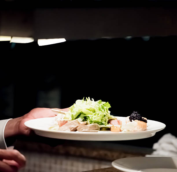 istock Waiter waiting for food in the kitchen 615748932
