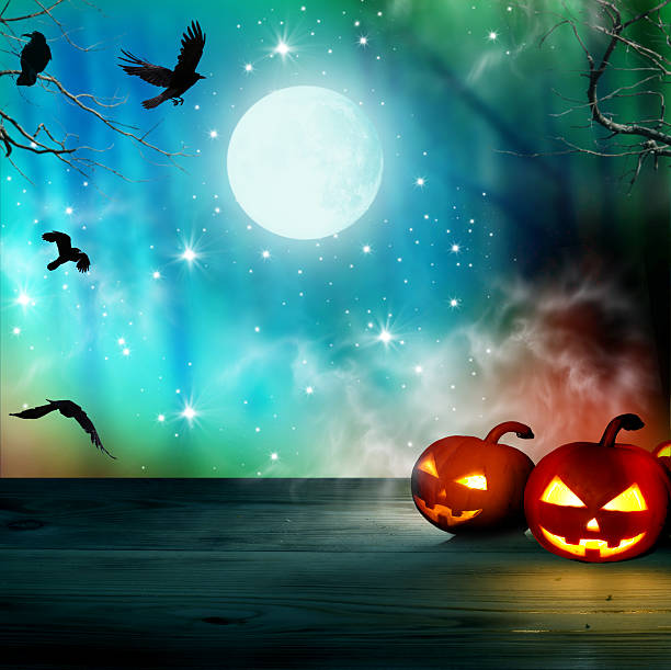 istock Halloween background .Night forest with full moon and pumpkins 615749612