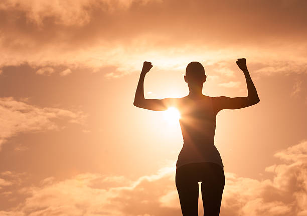 istock Strong and confident woman flexing her muscle. 615749780