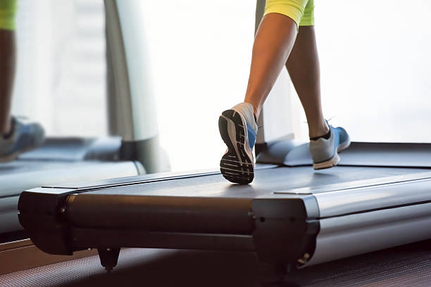 istock Woman exercising on treadmill 615749916