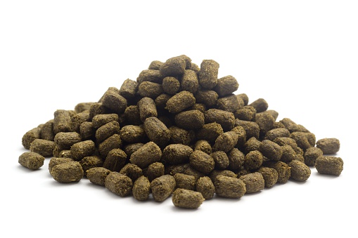 Rabbit food pellets isolated on a white background.