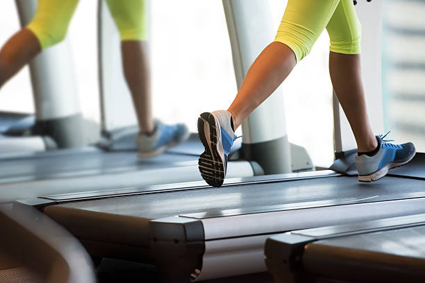 istock Woman exercising on treadmill 615750132