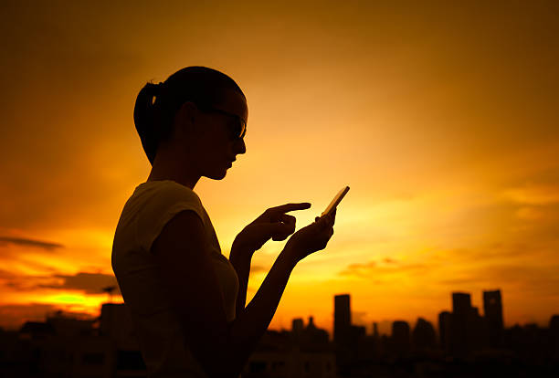 istock Woman using smart phone in the city 615750392