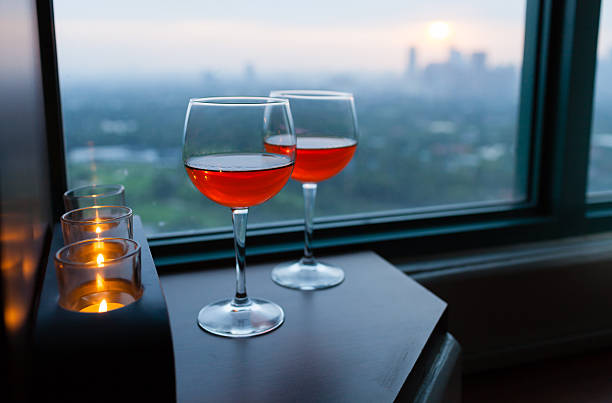 istock Wine glasses with city view 615793180