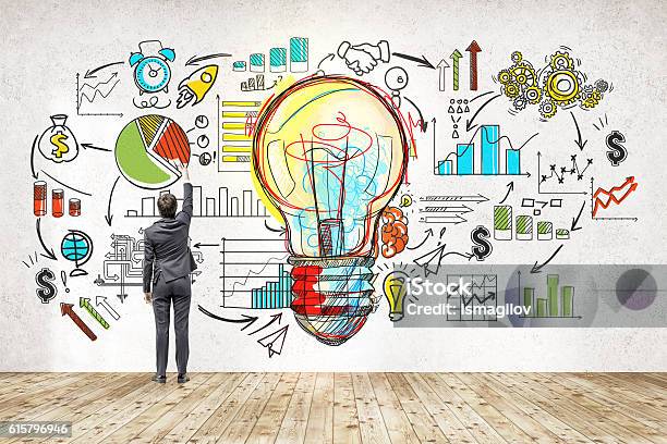 Businessman Near Blackboard With Startup Sketch Stock Photo - Download Image Now - Market Research, Light Bulb, Drawing - Art Product