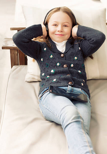 istock Little girl playing with tablet 615797132