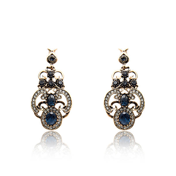 istock Pair of sapphire earrings isolated on white 615797278
