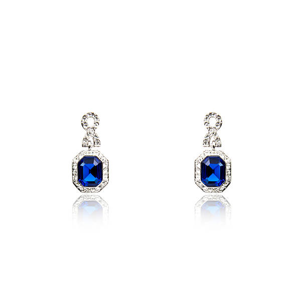 istock Pair of sapphire earrings isolated on white 615797318