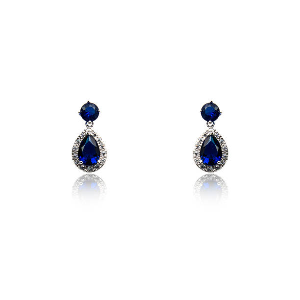 istock Pair of sapphire earrings isolated on white 615797410
