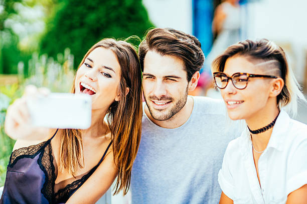 istock Happy friends taking selfie with smartphone 615797612